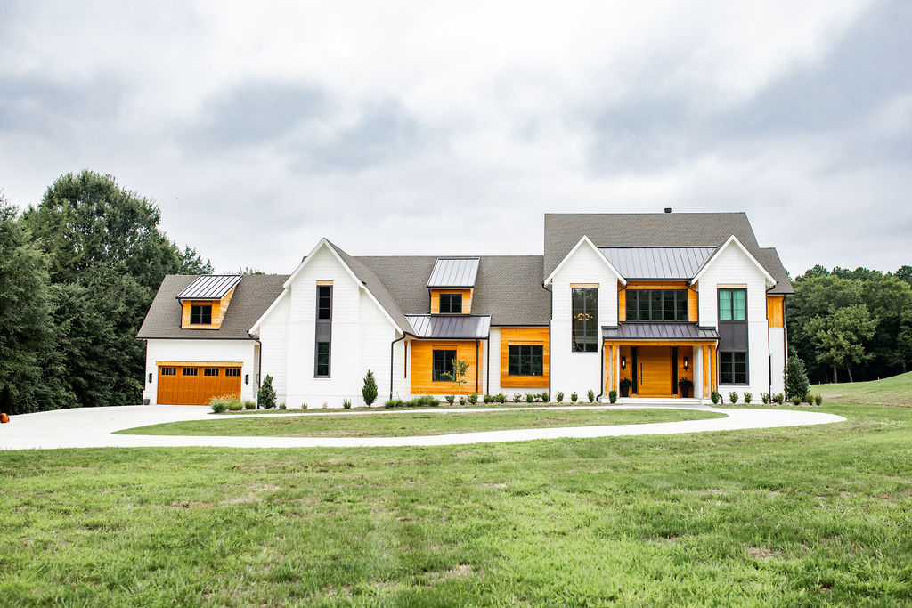 A Kennedy & Co kitchen transformation, marble waterfall island, natural wood cabinetry, open dining