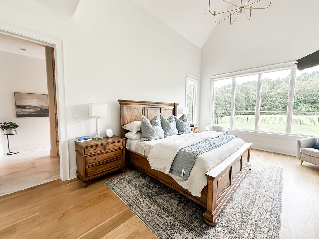 Primary bedroom, vaulted ceiling, floor-to-ceiling windows, white oak floors